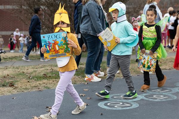 students walking with books